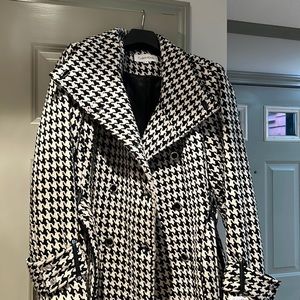 Calvin Klein… beautiful black and white belted wrap coat fully lined. Worn twice